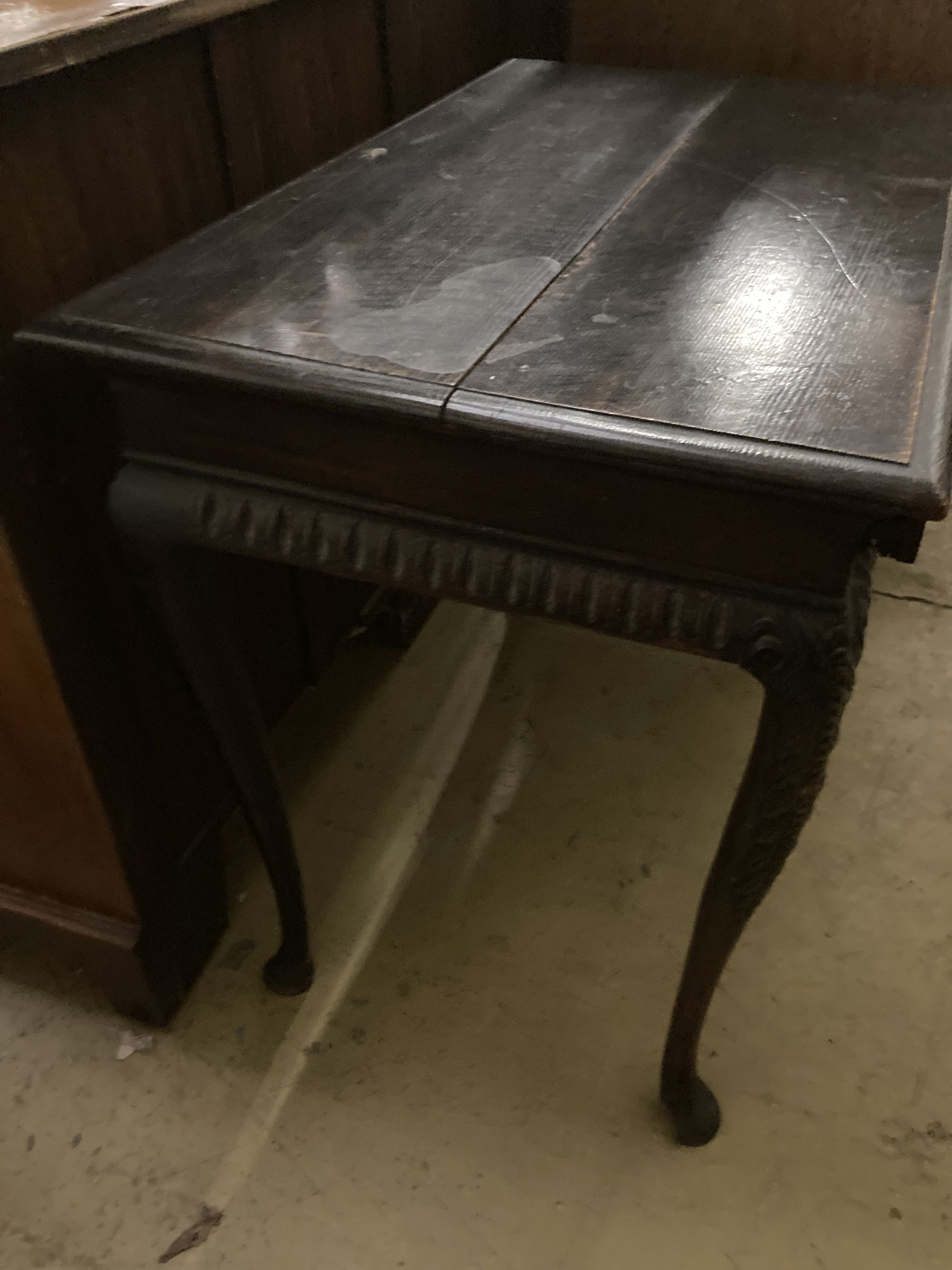 An 18th century oak side table, fitted single long drawers, later carved front, on cabriole supports, width 75cm, depth 47cm, height 66